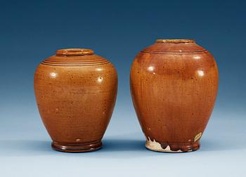 1407. A set of two yellow glazed jars, Tang dynasty (618-907 AD.).