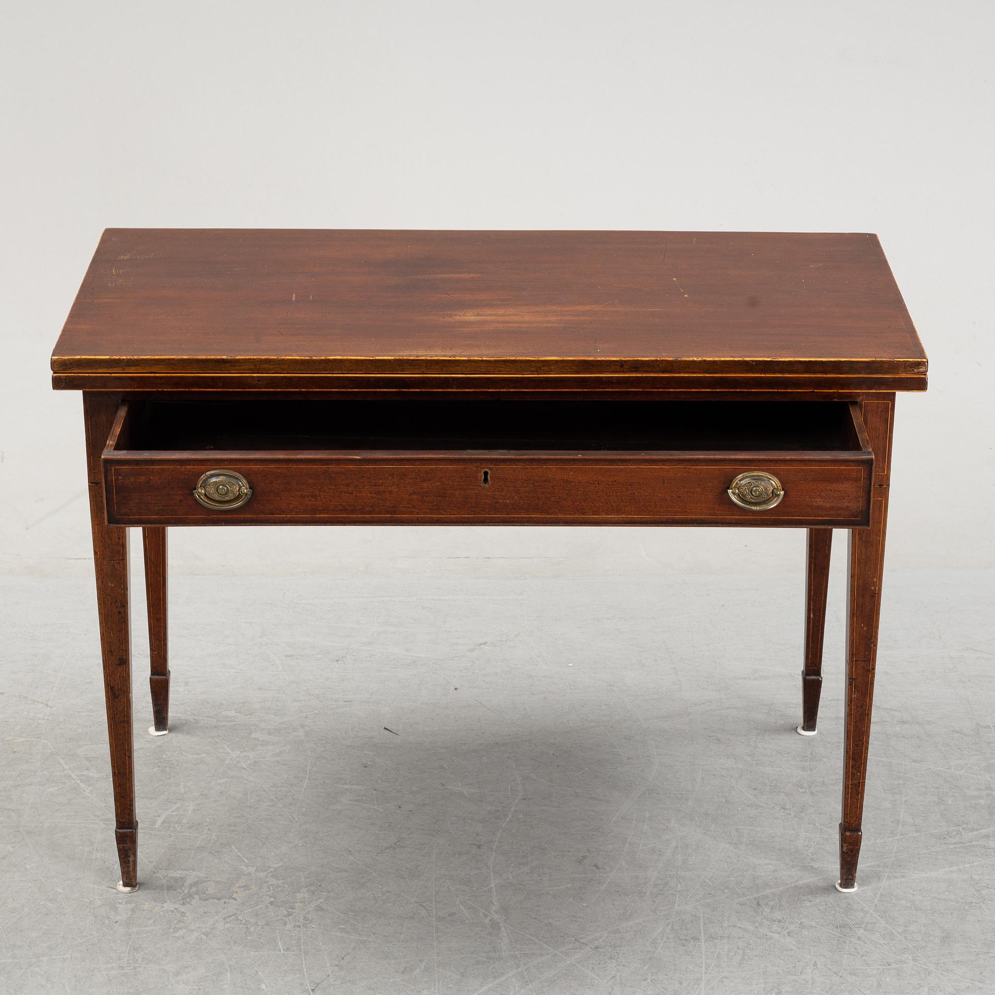 A mid 19th Century mahogany card table.