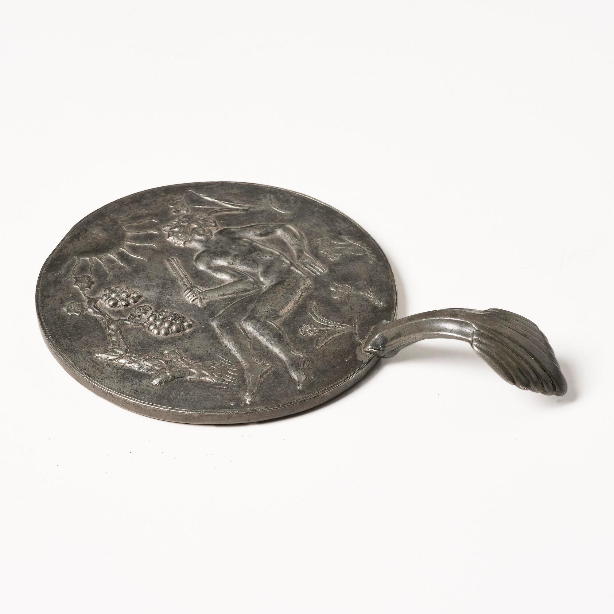 Nils Fougstedt, a pewter hand mirror model A 508, Firma Svenskt Tenn, Stockholm, 1920s-30s.