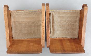 Axel Einar Hjorth, attributed, a pair of stained pine "Lovö" easy chairs, Nordiska Kompaniet, Sweden 1930's.