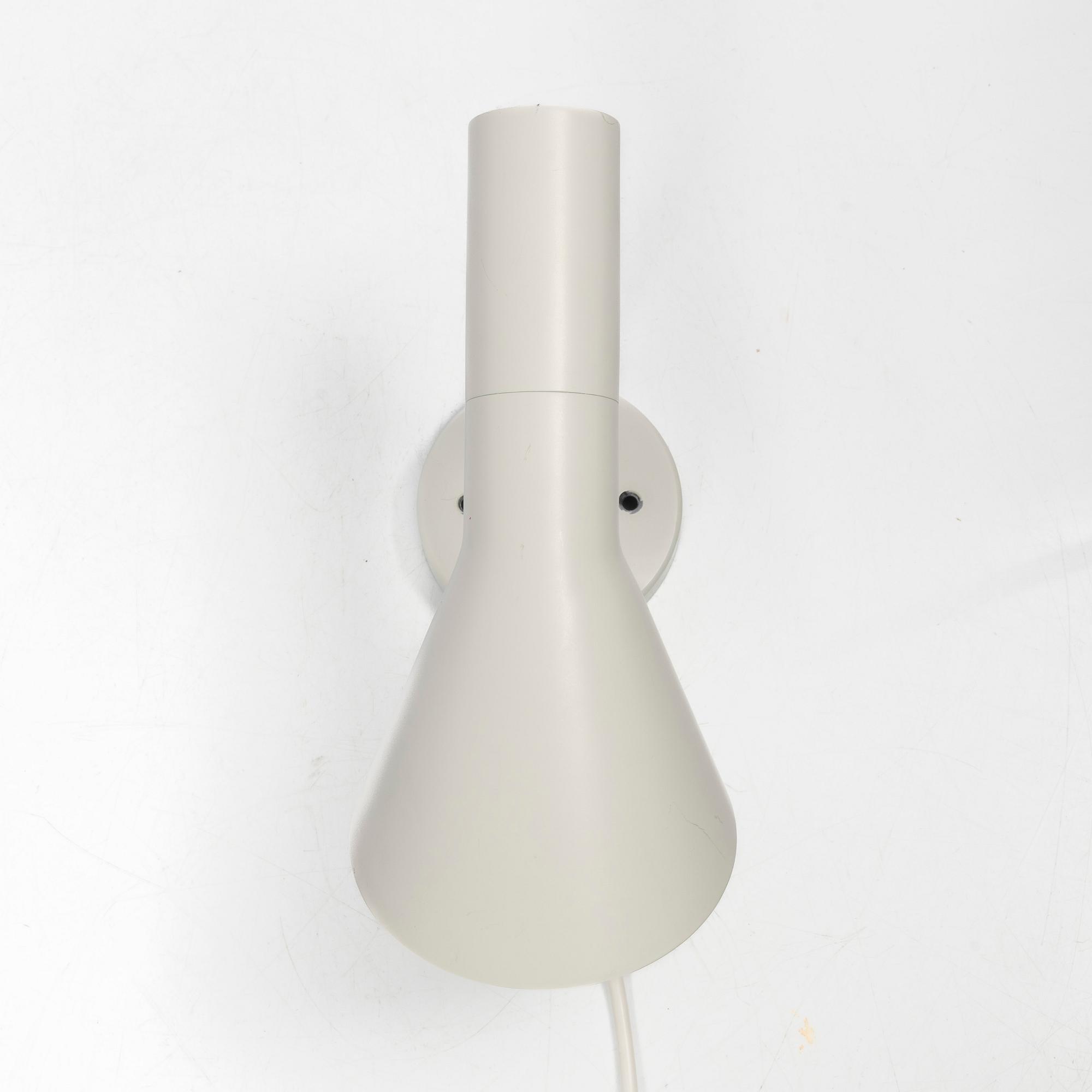 Arne Jacobsen, An 'AJ' wall lamp. Louis Poulsen, 21st century.