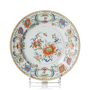 1026. A famille rose armorial dinner plate, Qing dynasty, Qianlong (1736-95) around 1745.