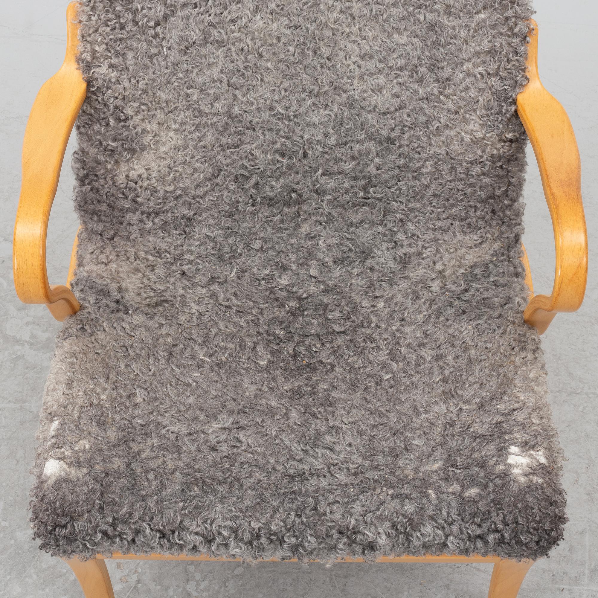Bruno Mathsson, Armchair with footstool, "Miranda", Bruno Mathsson International, Värnamo, 2001.