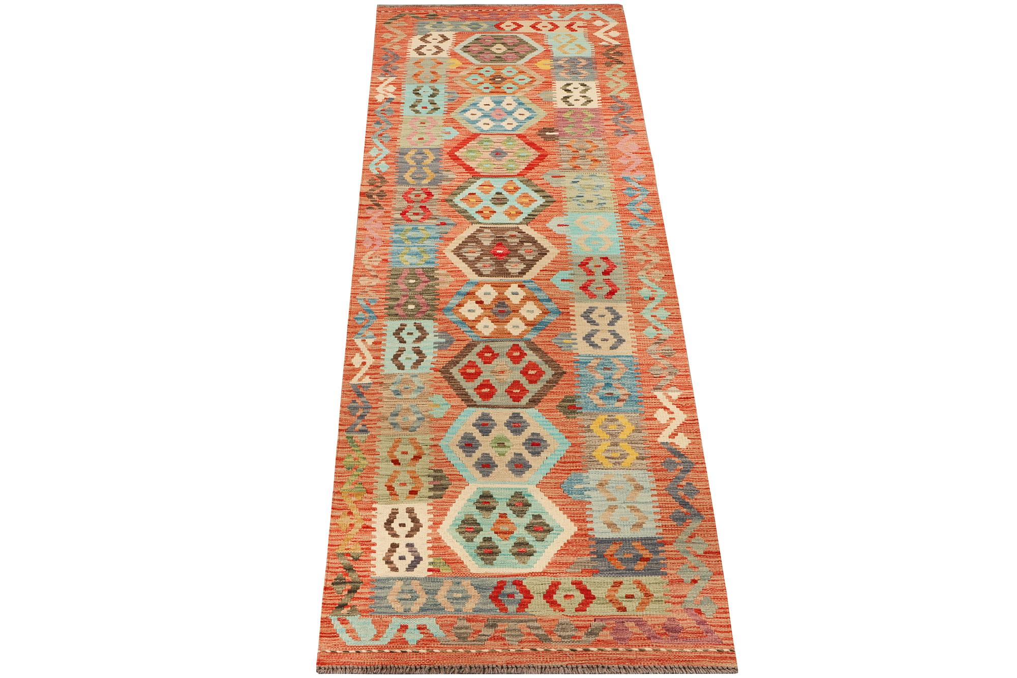 An Afghan kelim runner, c. 301 x 80 cm.