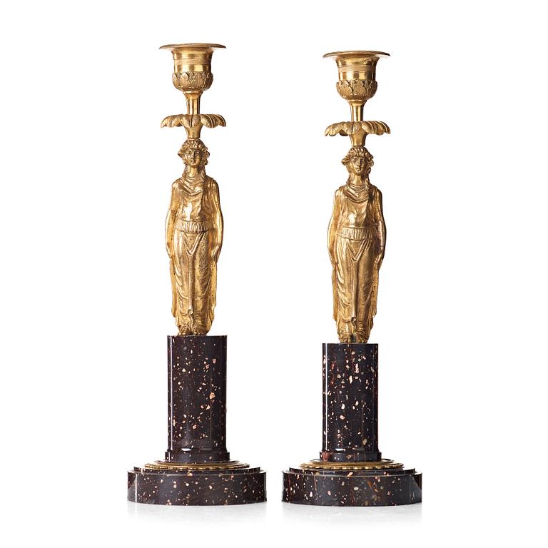 A pair of late Gustavian circa 1800 porphyry and bronze candlesticks.