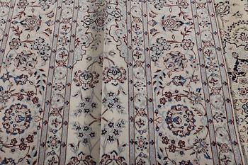 A carpet, Nain, part silk, ca 341 x 245 cm.