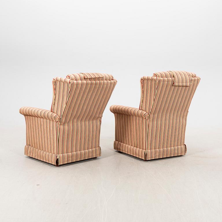 A pair of easy chairs with footstools by Bröderna Andersson 21st century.