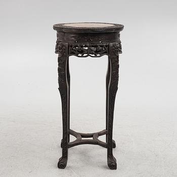 A Chinese wooden and stone table, 20th century.