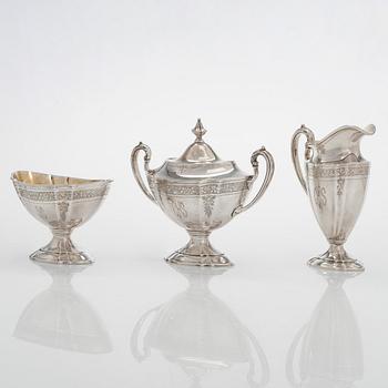 A five-piece sterling silver coffee and tea service, and 12 spoons, USA, first quarter of the 20th century.