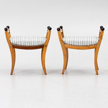 A pair of late Empire stools, mid-19th century.