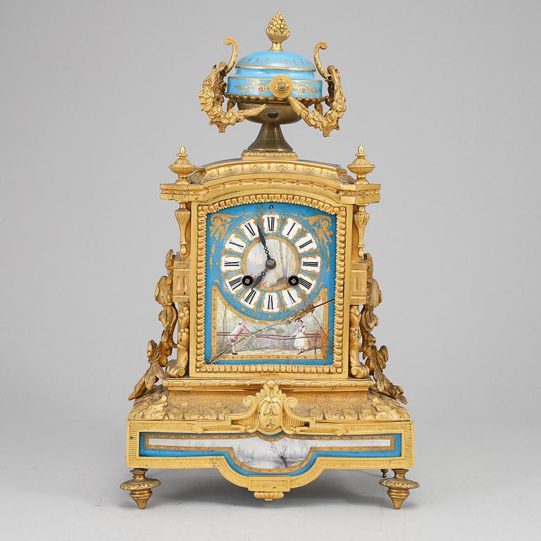 A late 19th Century bronze and porelain mantel clock.