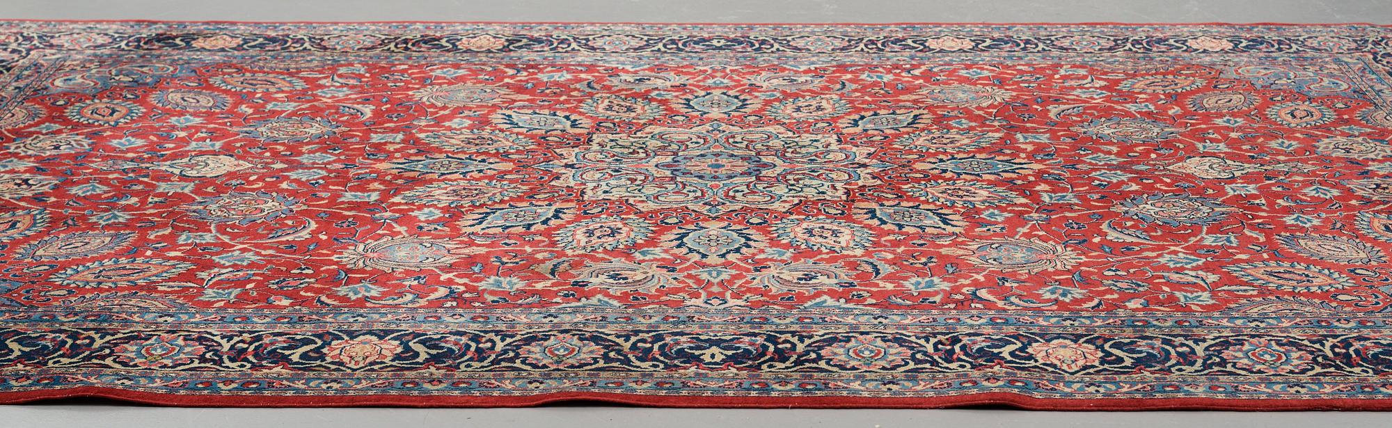 A carpet, a semi-antique/an old Persian, probably a Qazvin, ca 345-349 x 251,5-253 cm.