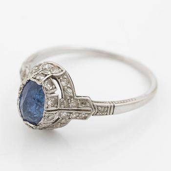 Ring 14K gold with a synthetic blue stone and small diamonds and white stones.