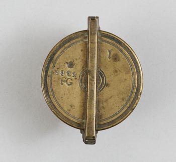 A brass set of measure, marked 1822.