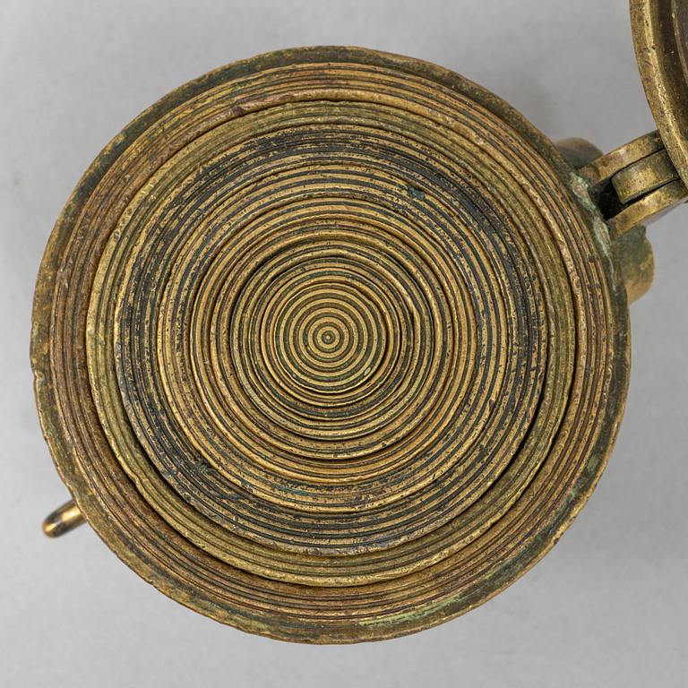 A brass weight set, late 19th century.