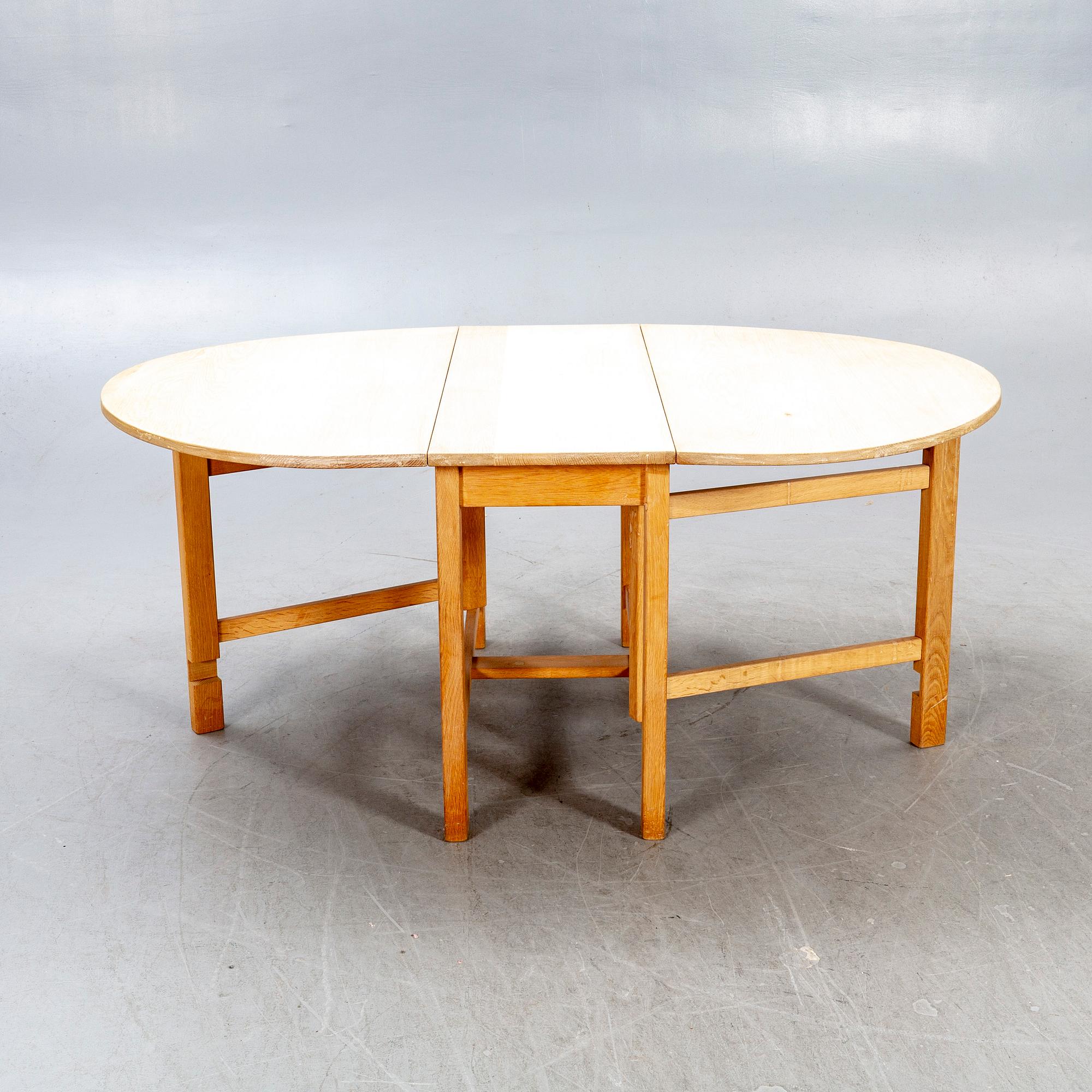A 20th century oak folding table.