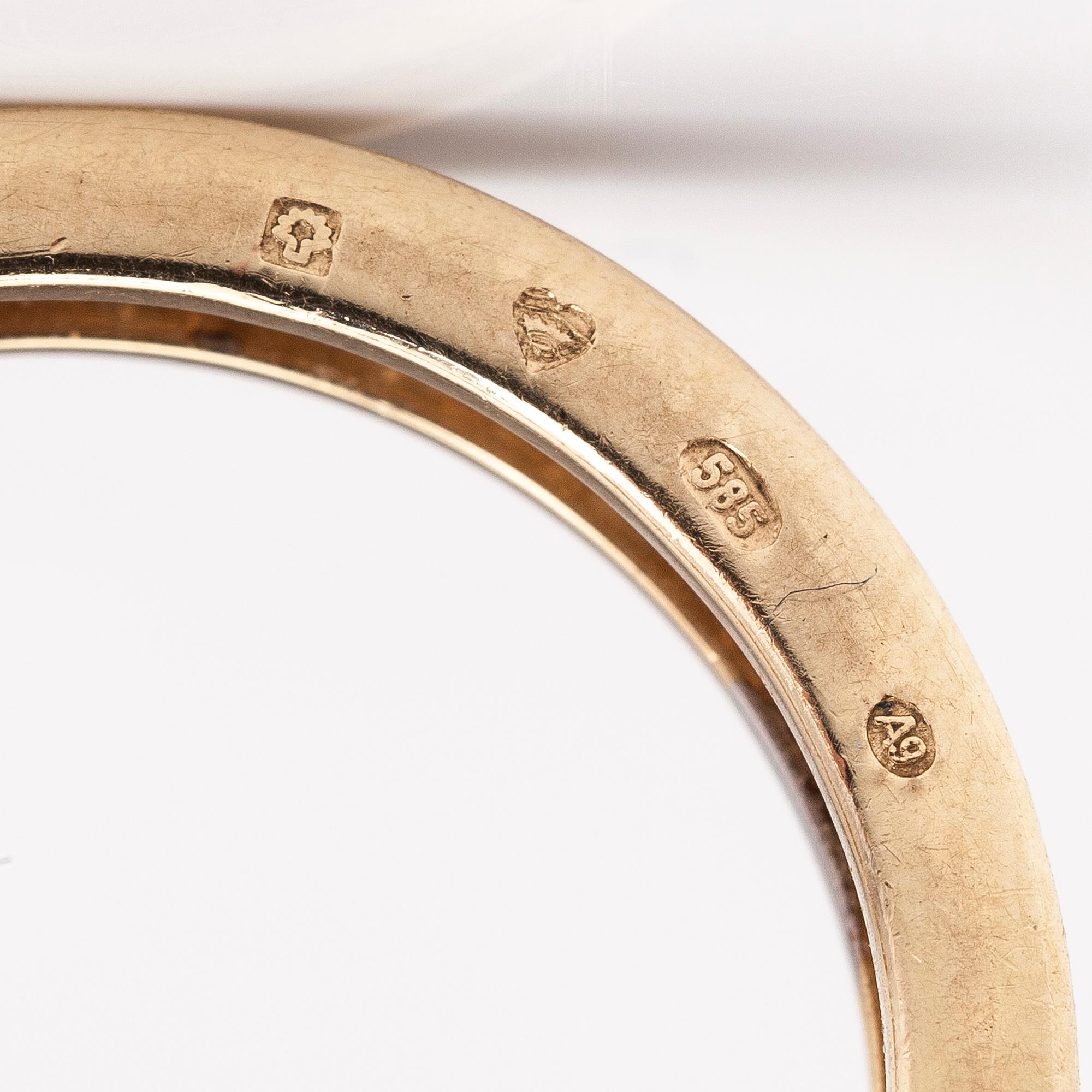 A 14K gold ring with diamonds ca. 0.21 ct in total. Timantttiset, Helsinki 2002.