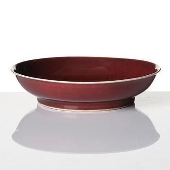 A copper-red glazed dish, Qing dynasty, Qianlong mark and of the period (1736-95).