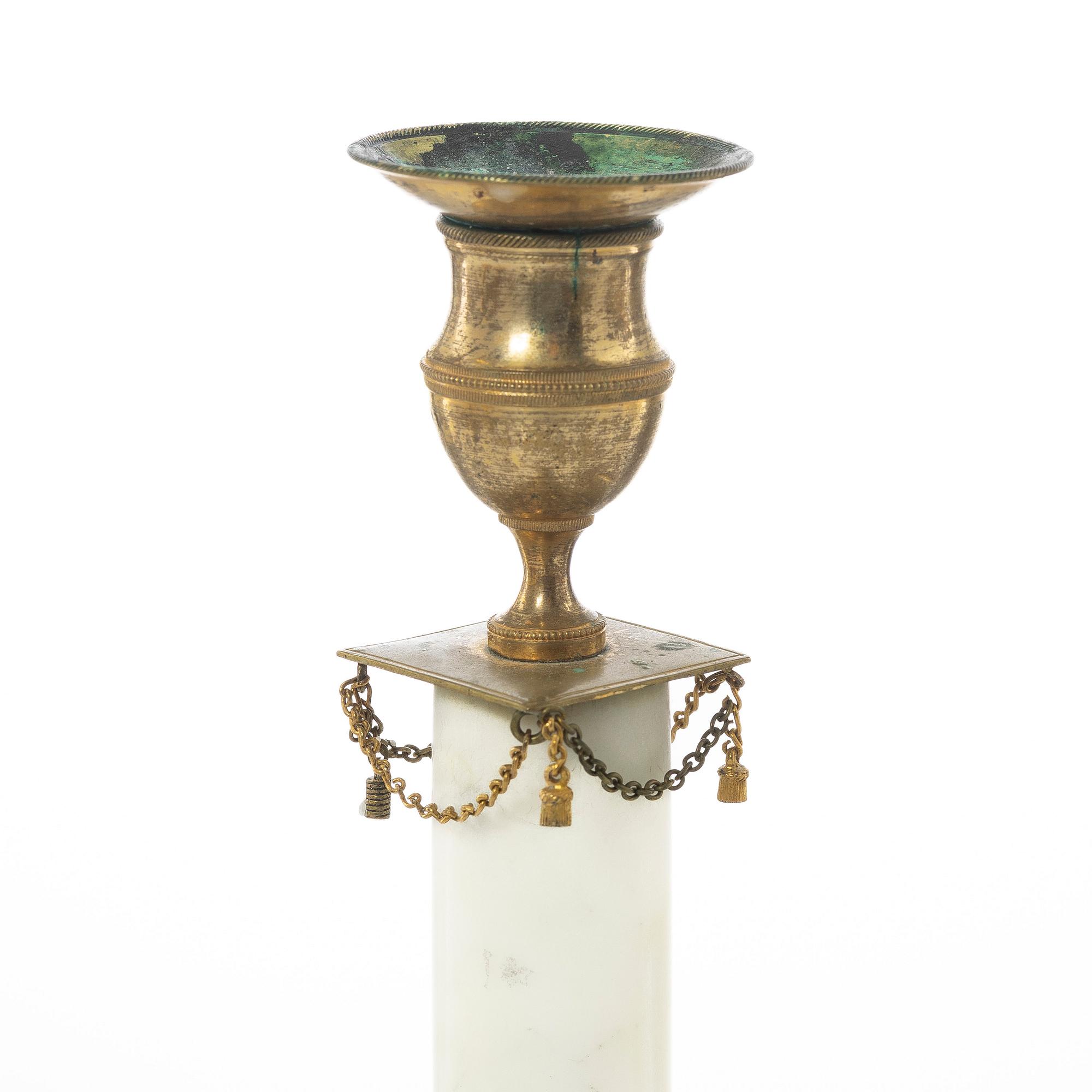 A pair of late Gustavian gilt brass and marble candlesticks, circa 1800.