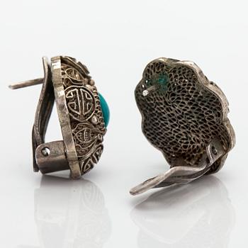 A bracelet and pair of earrings in silver with turquoises. Import marked Risto Aho, Helsinki 1964.