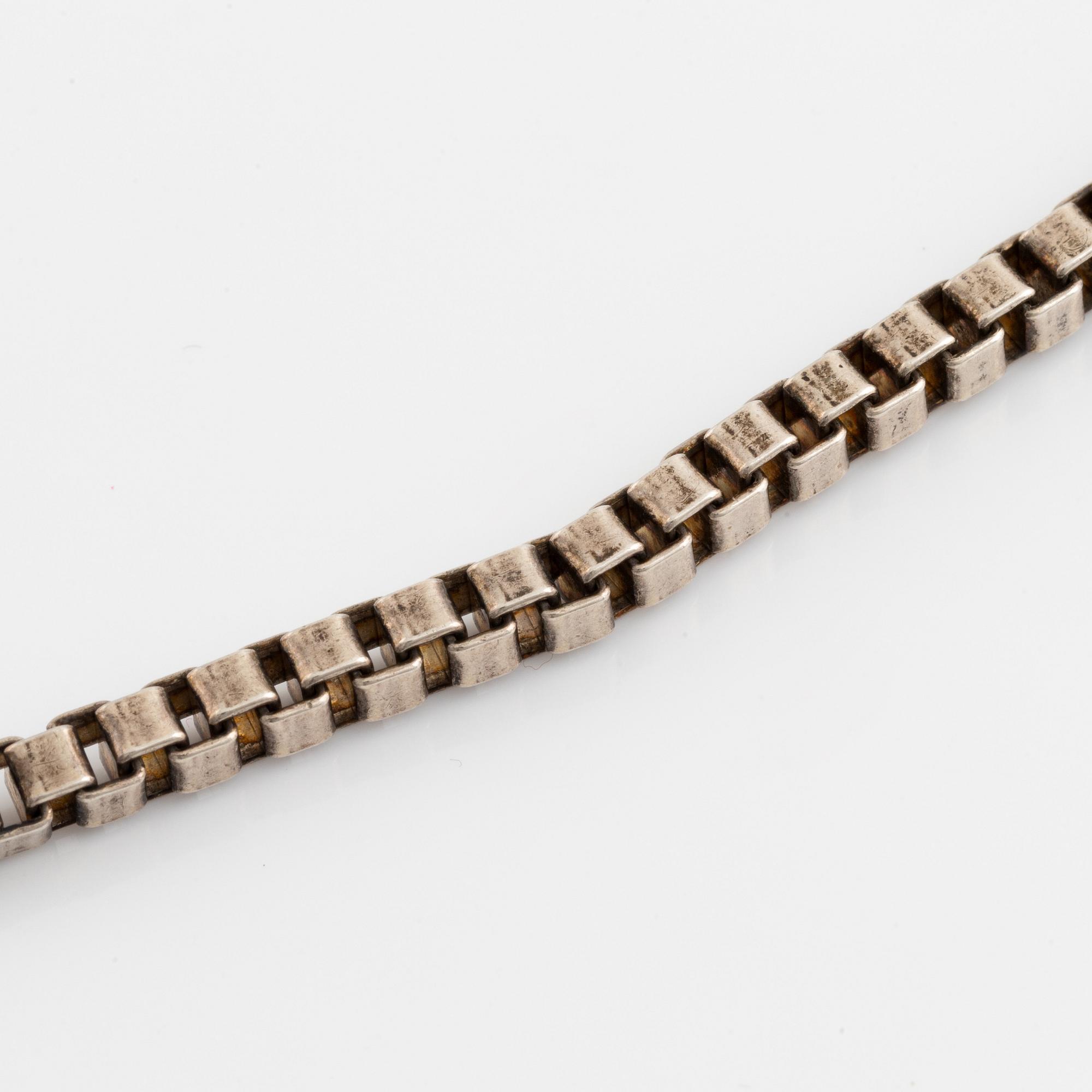 Silver necklace.