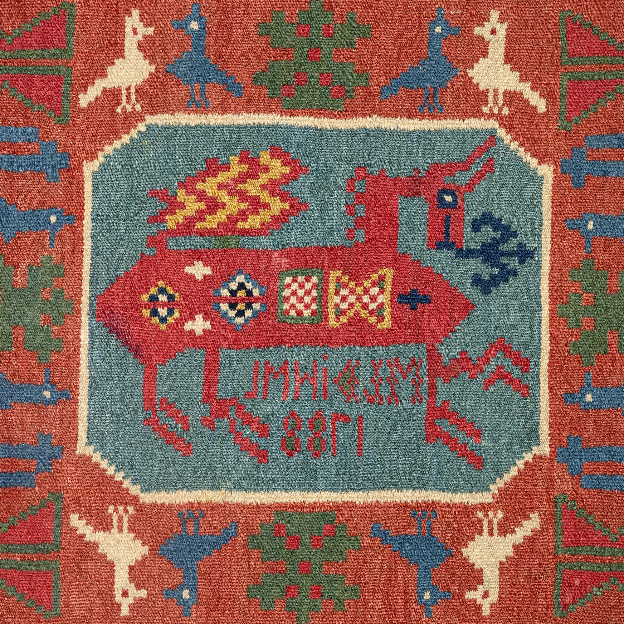 A double-interlocked tapestry carrige cushion, ca 108 x 51 cm, 'Bäckahästen', dated 1788.