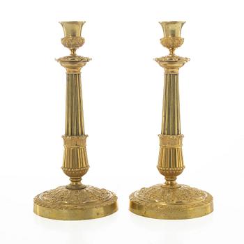 A pair of French Empire candlesticks, early 19th century.