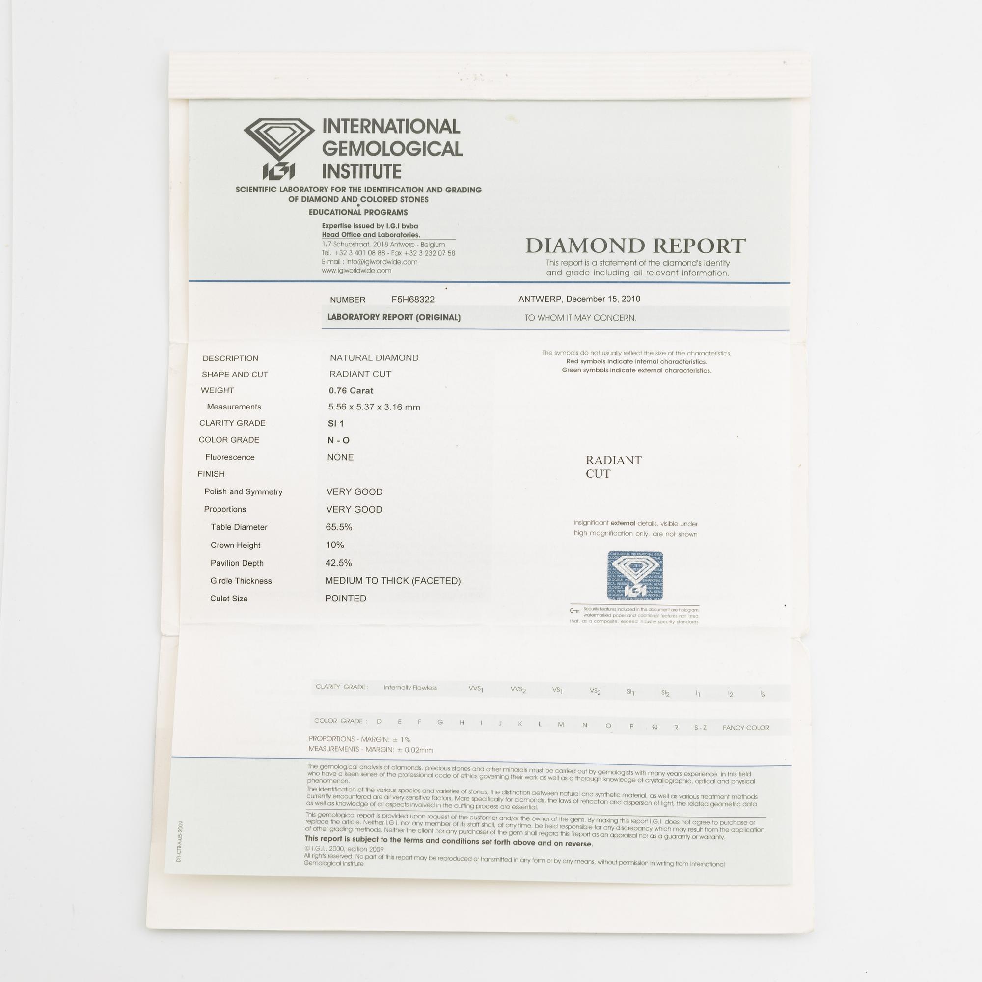 An 18K gold ring set with a radiant-cut diamond.