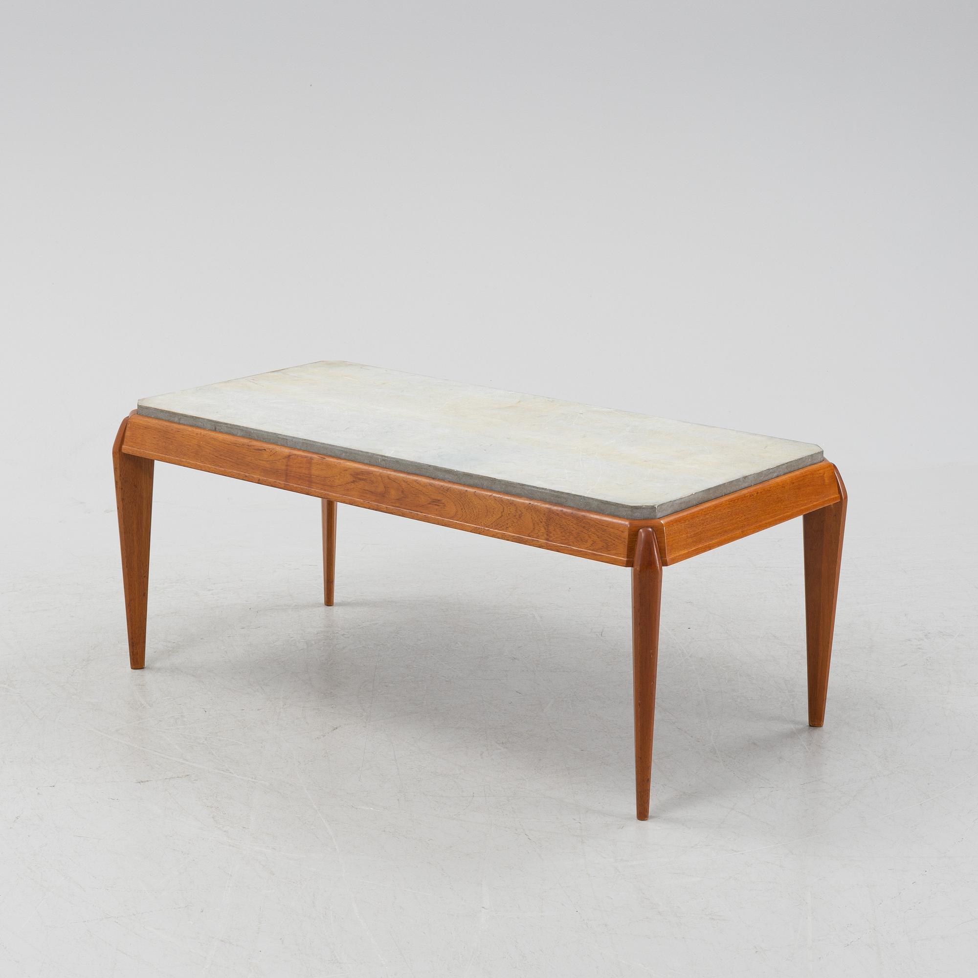 A mid 20th Century coffee table with a stone top.