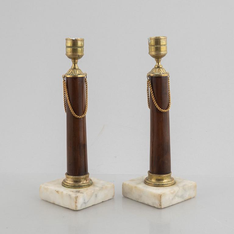 A pair of late Gustavian gilt brass, marble and birch candlesticks, circa 1800.