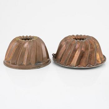 Four copper cake moulds. 18th and 19th Century.