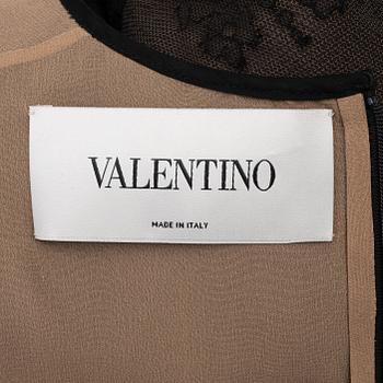 Valentino, a black lace dress, size 6.
