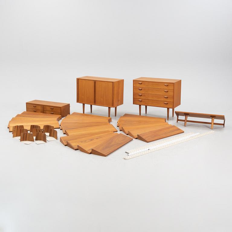 A teak and teak veneered shelf system, mid 20th century.