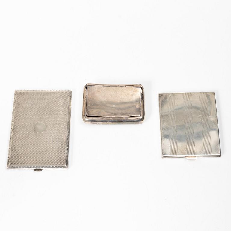 Two cigarette cases and a snuffbox, silver, Sweden and Swedish import marks respectively.