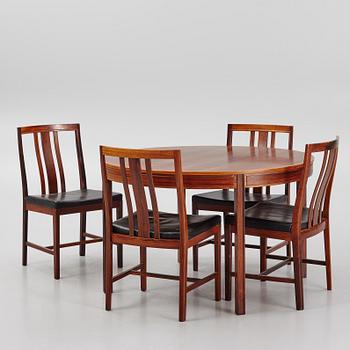 Bertil Fridhagen, a rosewood-veneered dining table with four chairs, BOdsfors, Sweden, 1960's.