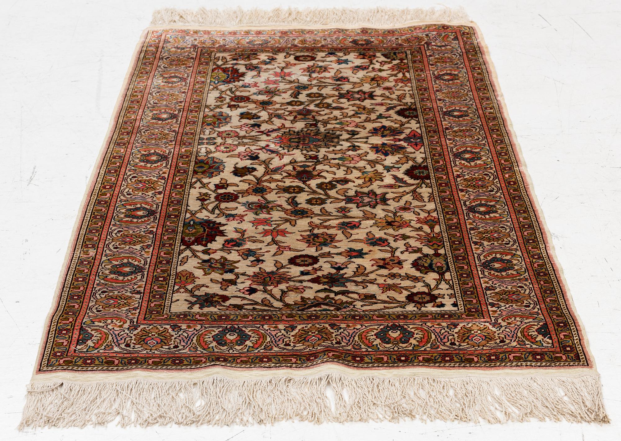 An Oriental silk rug, c. 122 x 76 cm.