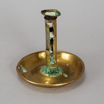 A 19th century brass night light holder.