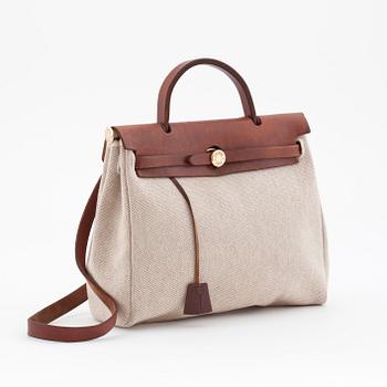 HERMÈS, a canvas and leather bag in two parts, "Herbag".