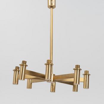 Hans-Agne Jakobsson, an eight-light brass ceiling light from Markaryd, Sweden.