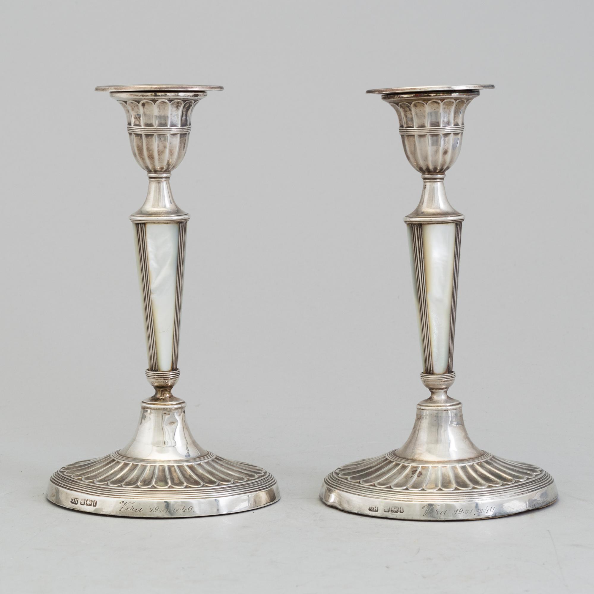 HARRISON BROTHERS & HOWSON, a pair of silver and mother of pearl candlesticks from Sheffield, England, 1926.