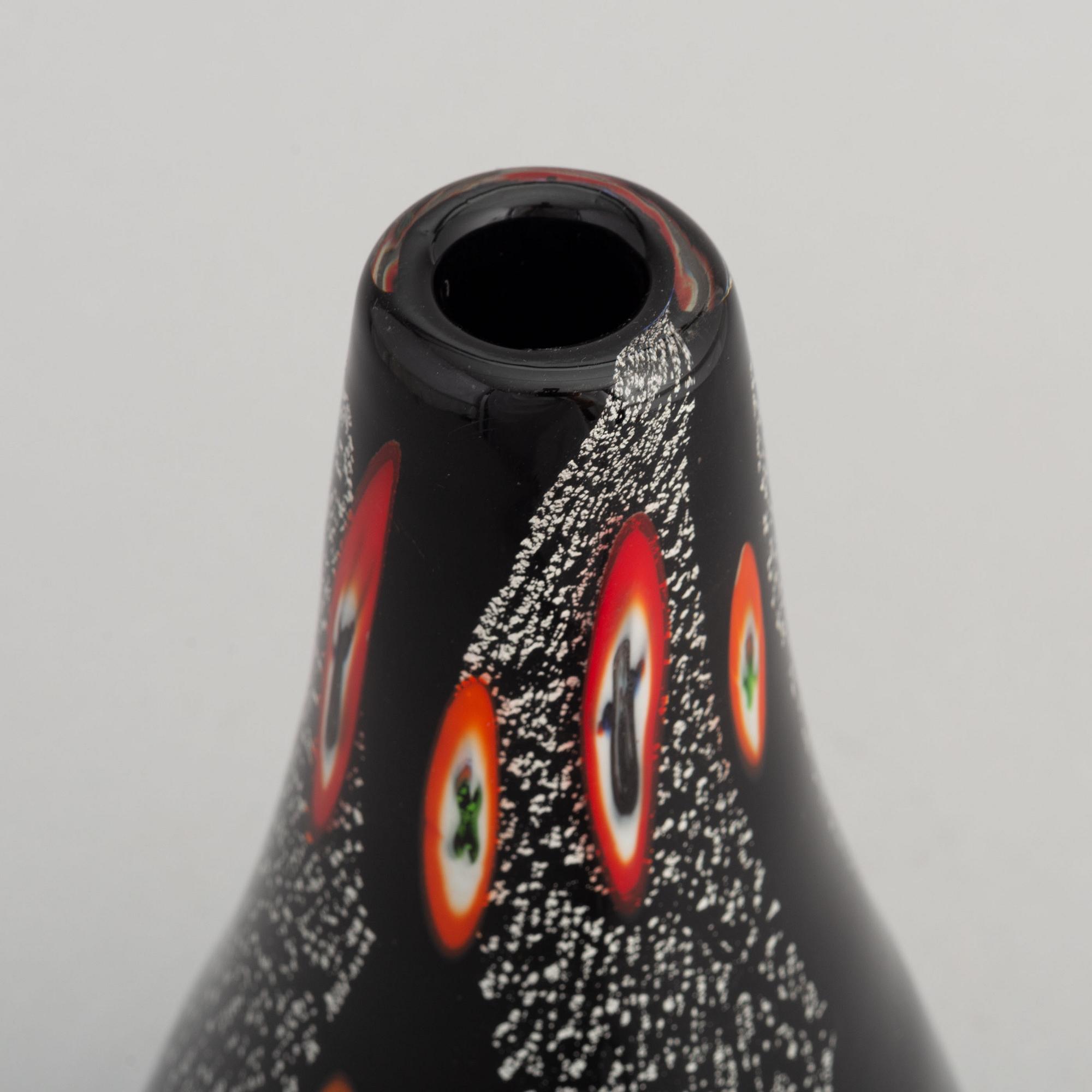 A black pear-shaped glass vase, possibly designed by Alfredo Barbini, Murano, Italy.