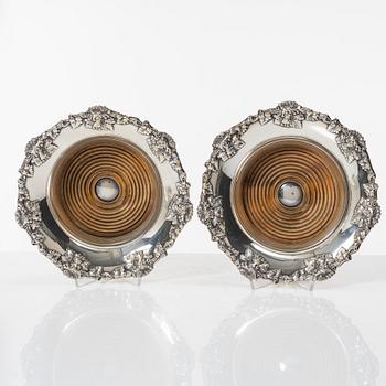 A pair of silver plated coasters, England 20th century.