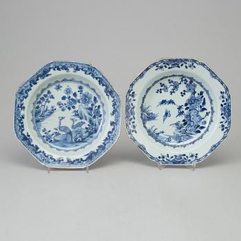 Two blue and white dishes and two cups with dishes, Qing dynasty, Qianlong (1736-95) and Kangxi (1662-1722).