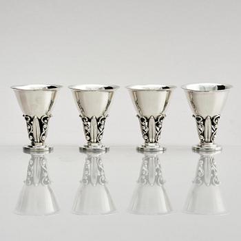 Evald Nielsen, four sterling silver beakers/cups on a foot, Denmark 20th century.