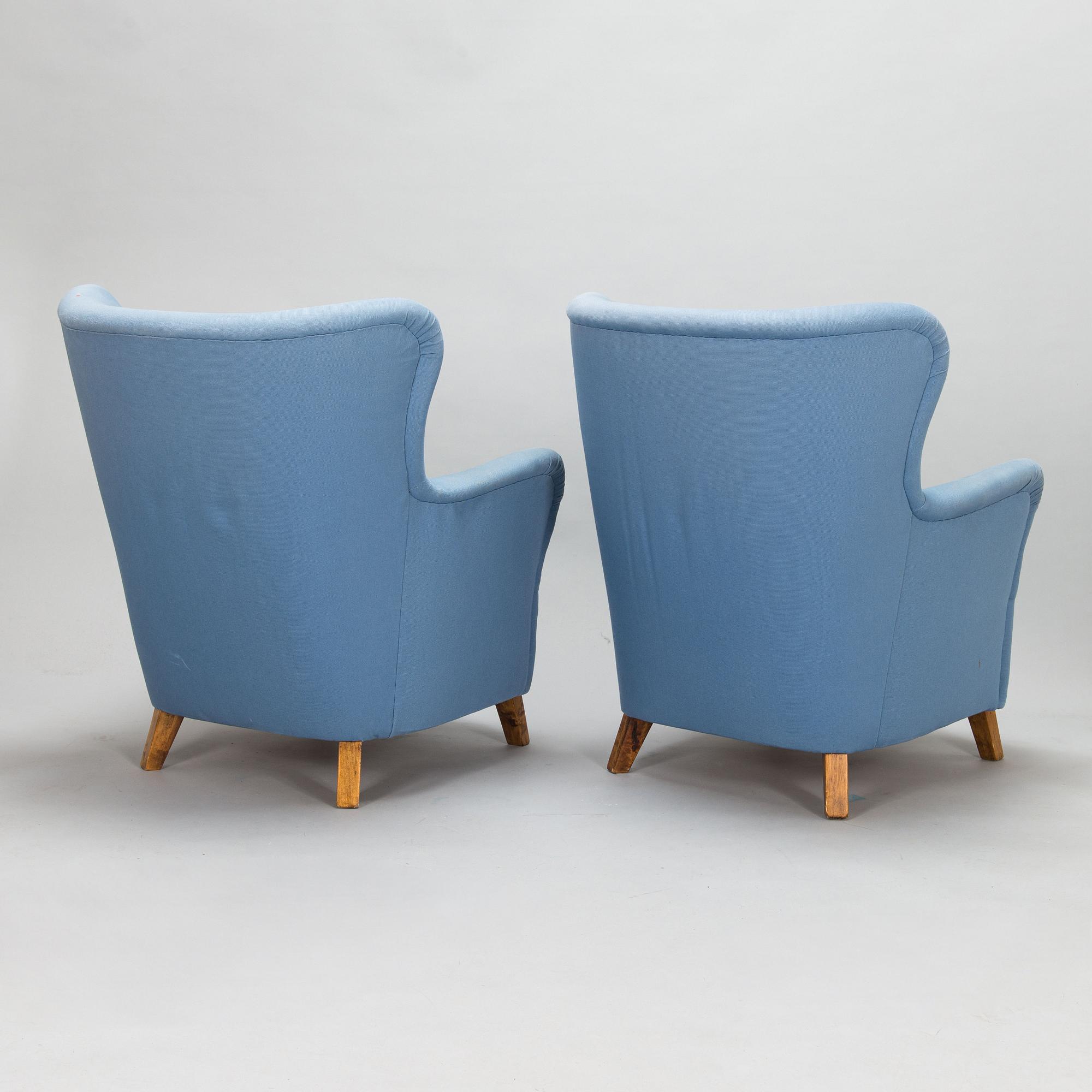 A pair of mid-20th-century armchairs.