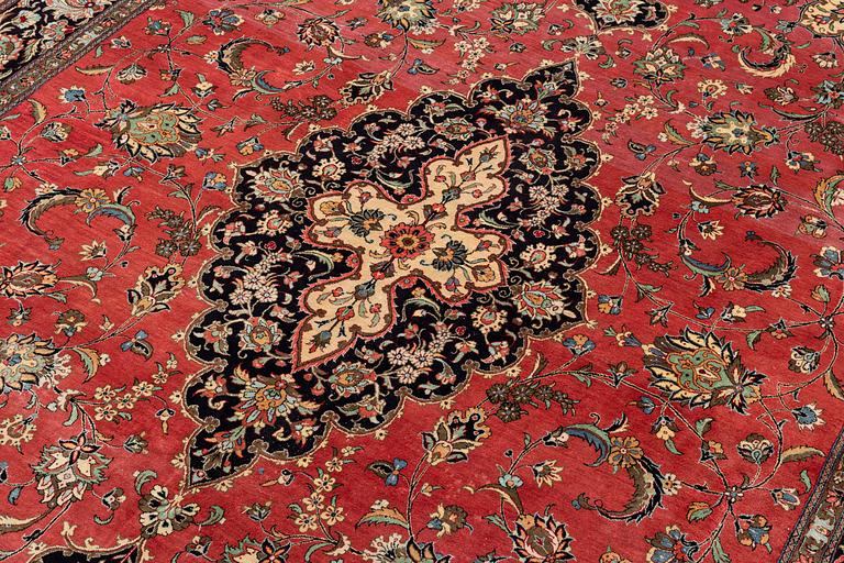 A 1960's silk Qum carpet, c. 312 x 201 cm.
