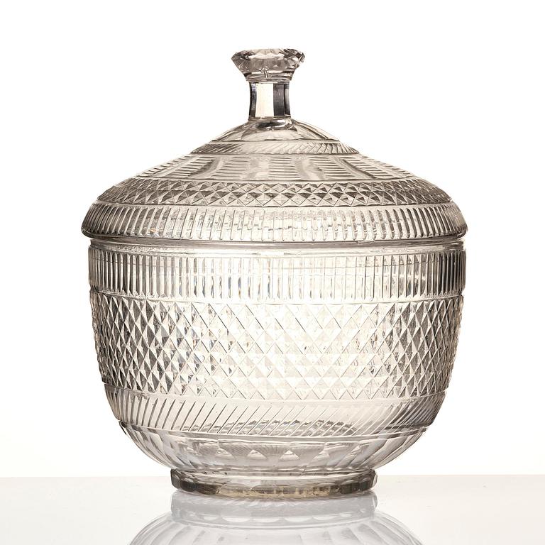 A cut glass punch bowl with cover, stand and ladle, Empire, first part of the 19th century.