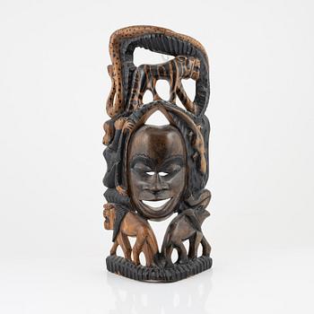 A wooden mask, Gambia, 21st Century.