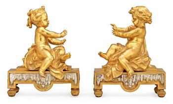 833. A pair of French 19th century gilt and silvered bronze chenets.