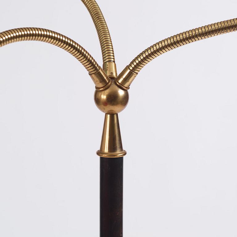 Josef Frank, a brass and black lacquered floor lamp model "2431", Firma Svenskt Tenn, Sweden.